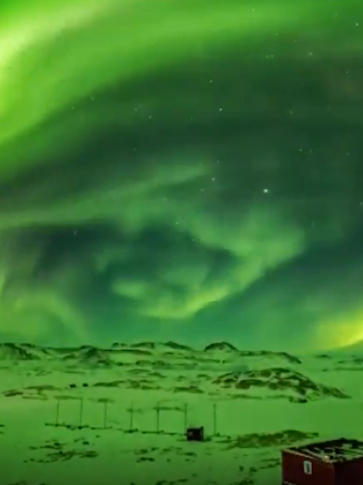 Aurora lights up the night sky over Zhongshan Station in Antarctica