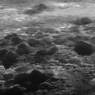 Close-up of icebergs and icy plains on Pluto, taken by NASA's New Horizons spacecraft - showing geological activity and moving blocks of water ice on the surface of the dwarf planet.